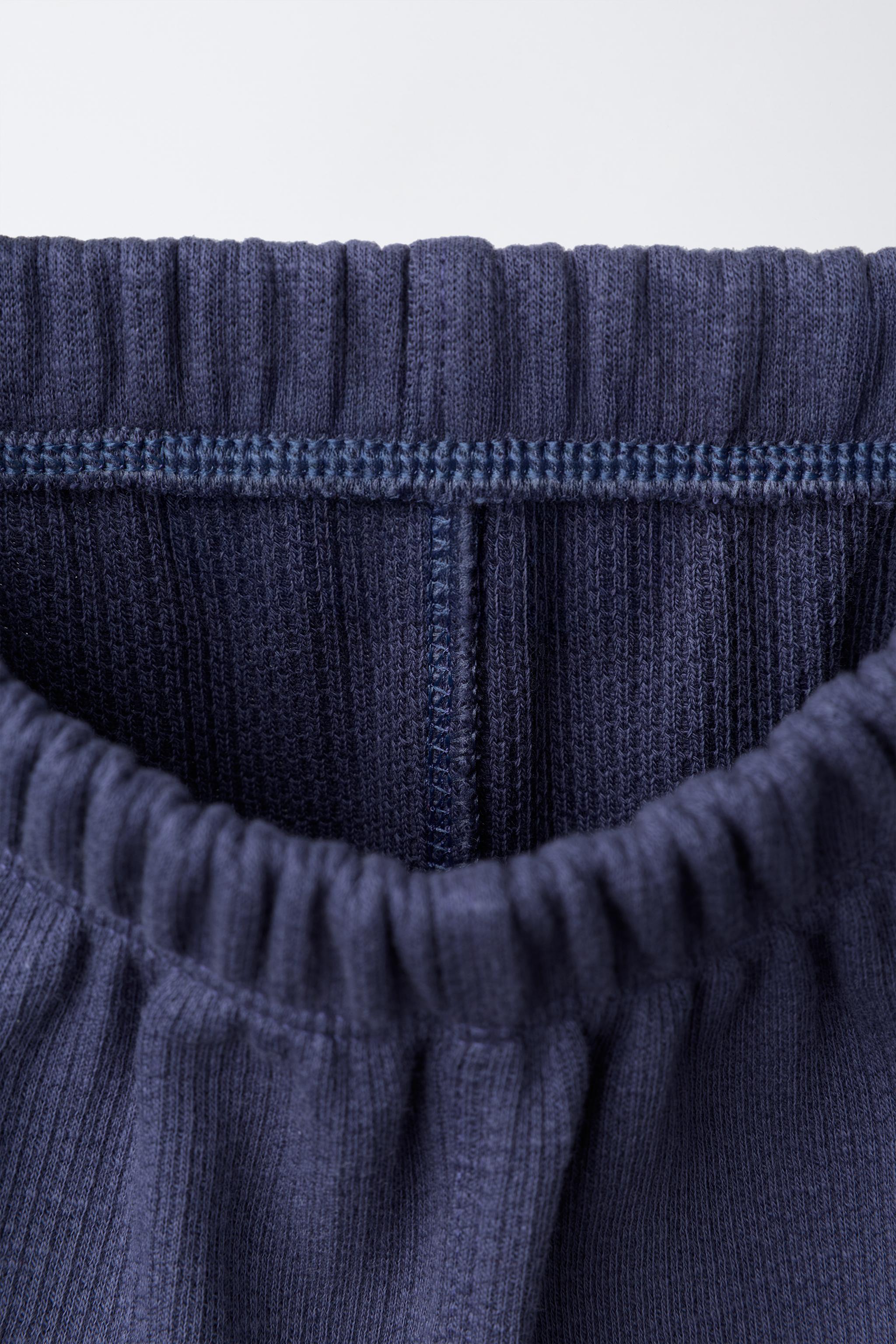 LABEL POCKET TROUSERS